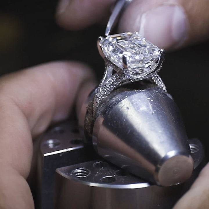 Emerald Cut Three-Stone Ring with Trapezoid Step-Cut Side Stones