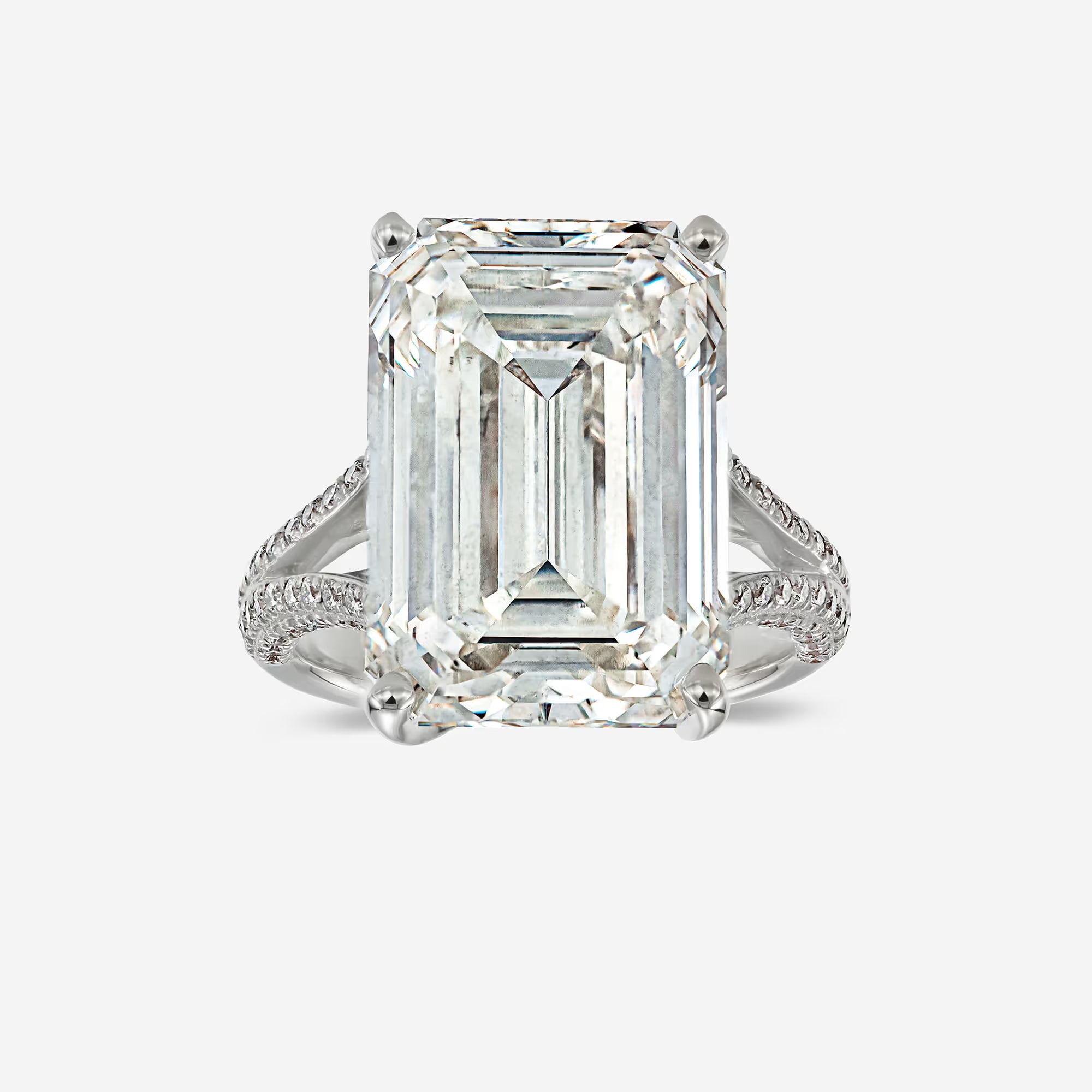 Emerald Cut Three-Stone Ring with Trapezoid Step-Cut Side Stones
