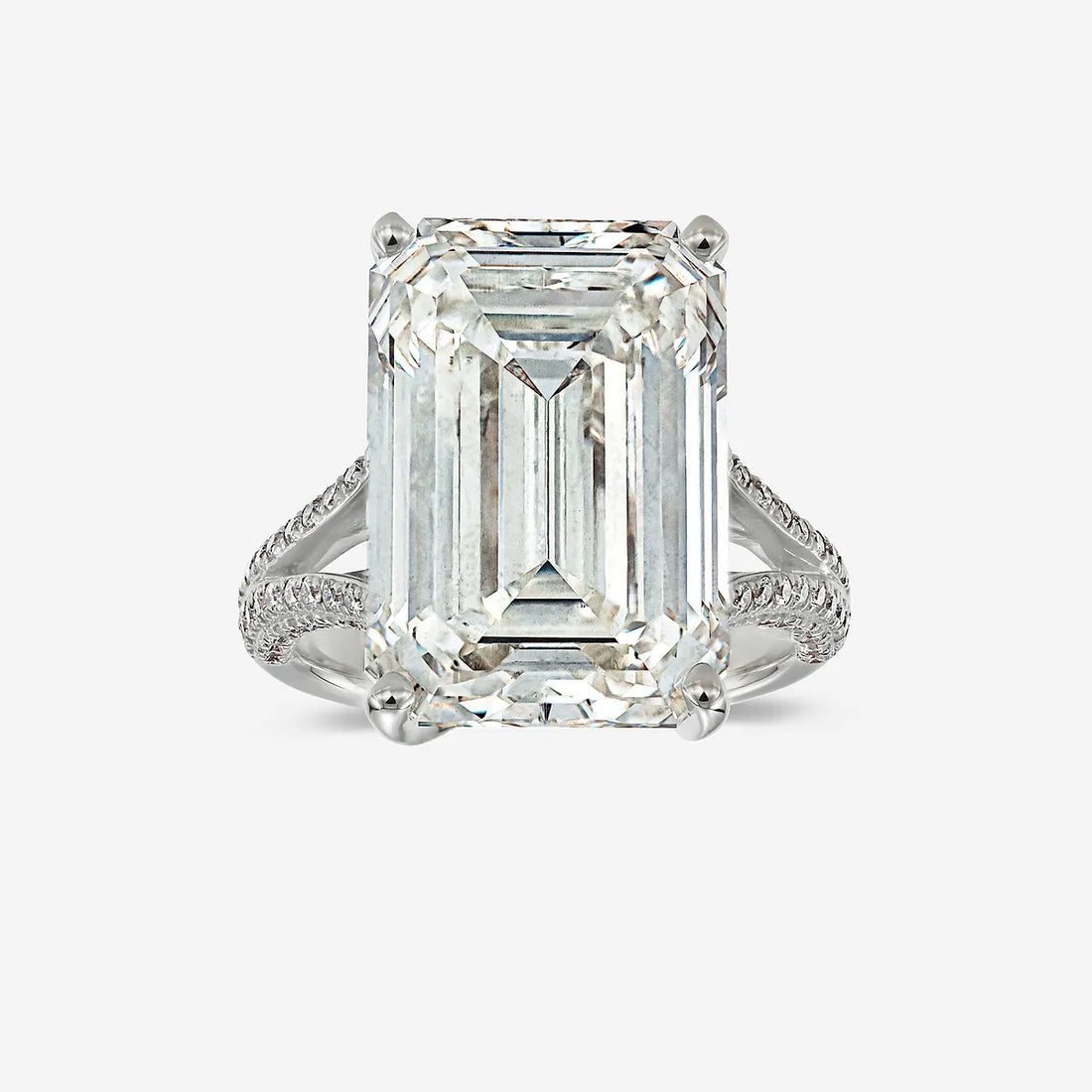Emerald Cut Three-Stone Ring with Trapezoid Step-Cut Side Stones