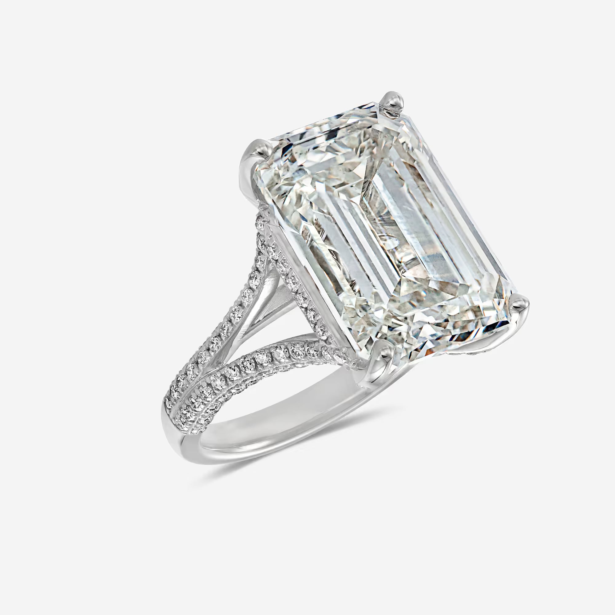 Emerald Cut Three-Stone Ring with Trapezoid Step-Cut Side Stones