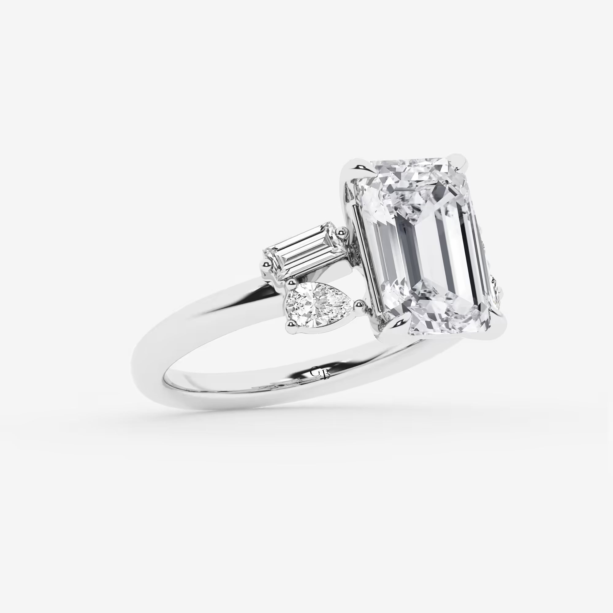Emerald Cut Ring with Asymmetric Baguette & Pear Diamond Cluster Shoulders