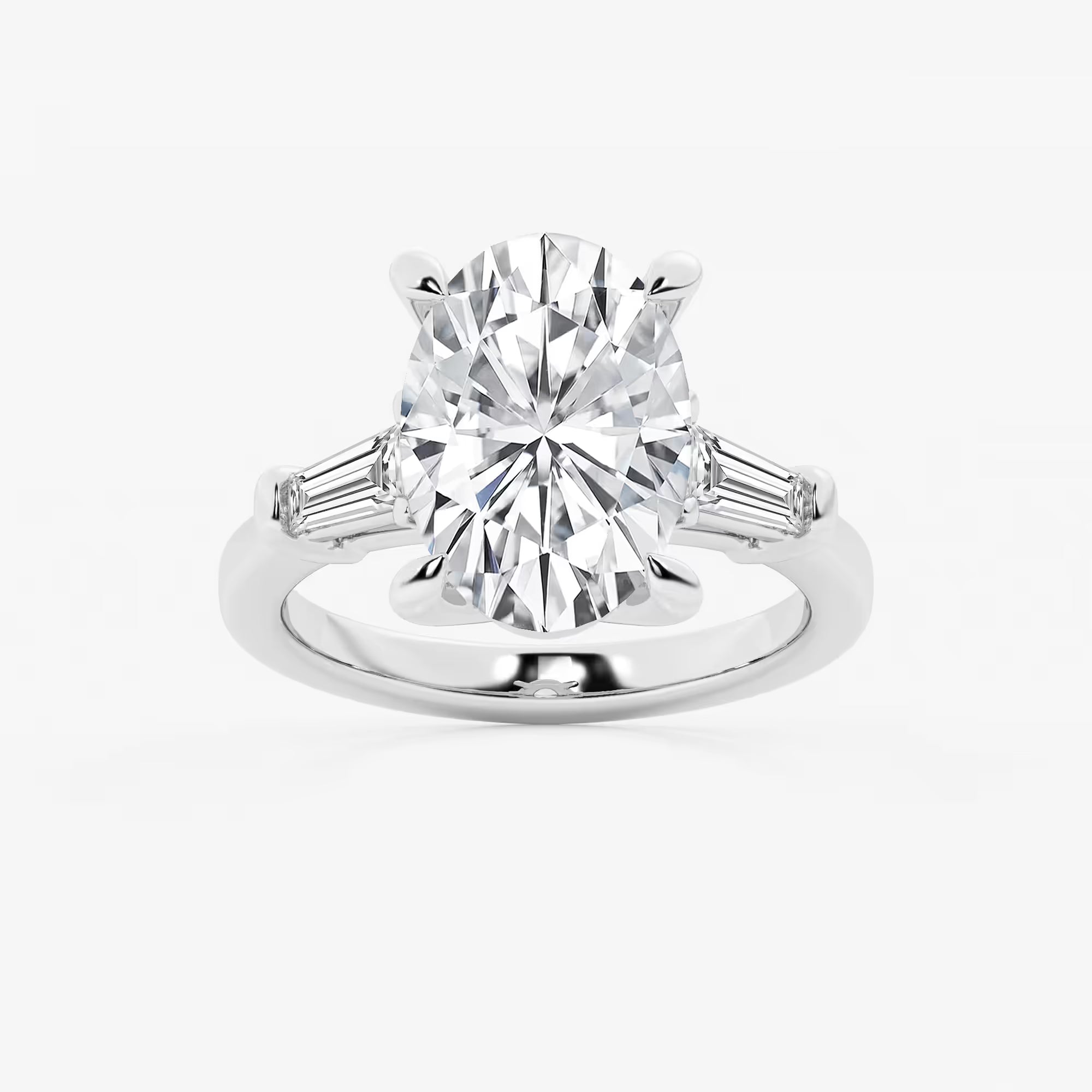 Oval Cut Diamond Engagement Ring with Tapered Baguette Side Stones in White Gold