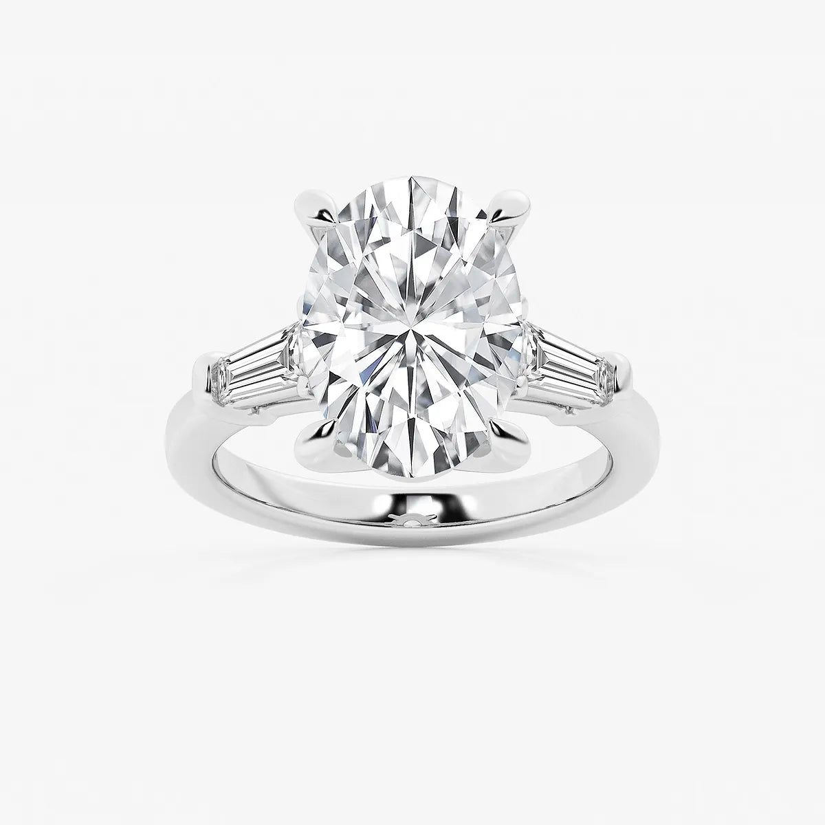 Oval Cut Diamond Engagement Ring with Tapered Baguette Side Stones in White Gold