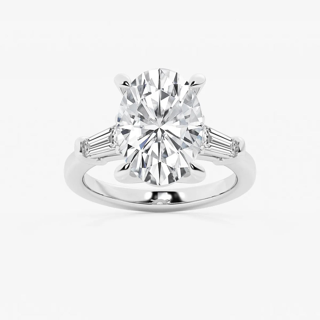 Oval Cut Diamond Engagement Ring with Tapered Baguette Side Stones in White Gold
