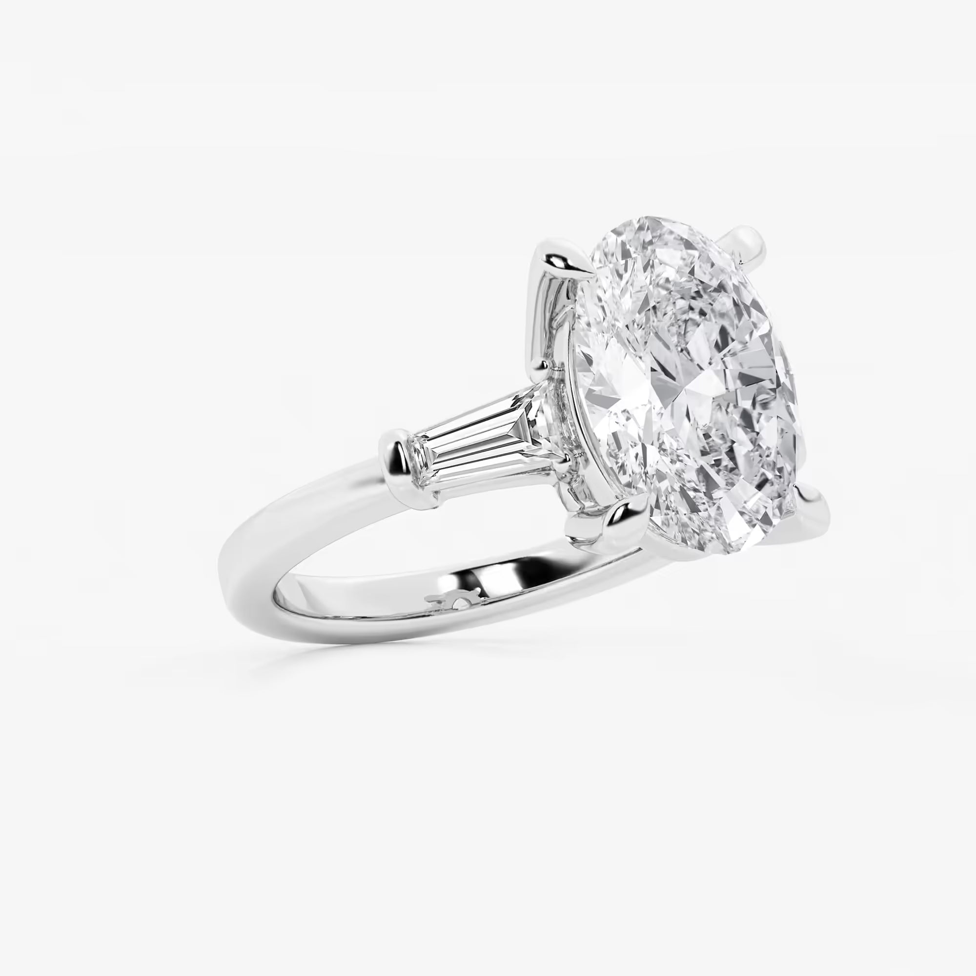 Oval Cut Diamond Engagement Ring with Tapered Baguette Side Stones in White Gold