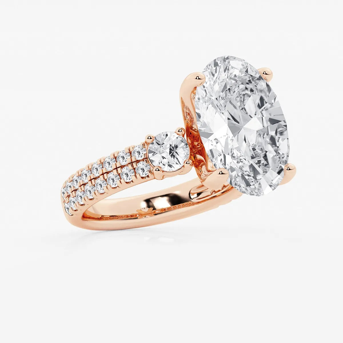 Luxurious Oval Cut Three-Stone Lab-Grown Diamond Pavé Engagement Ring