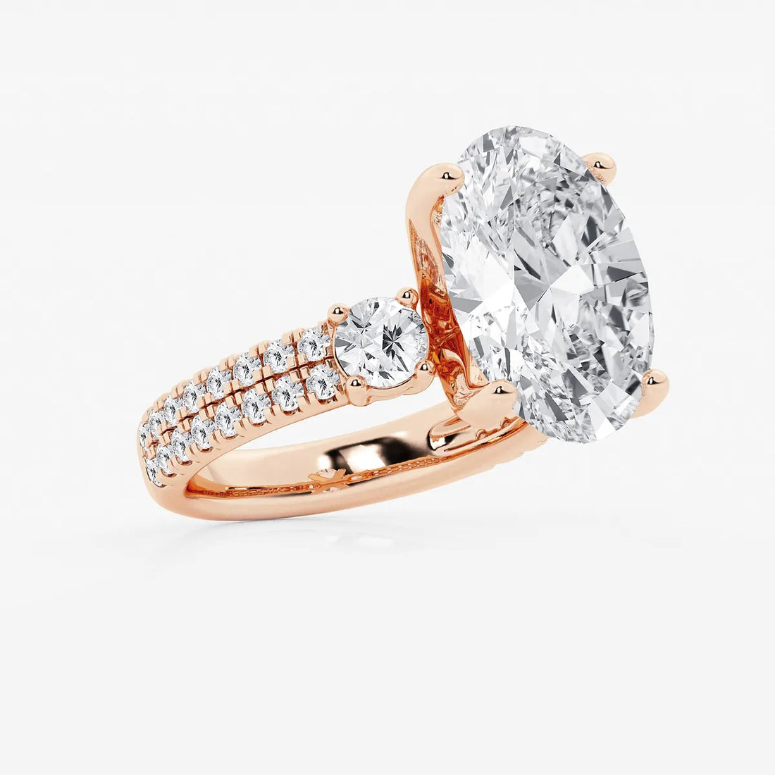 Luxurious Oval Cut Three-Stone Lab-Grown Diamond Pavé Engagement Ring