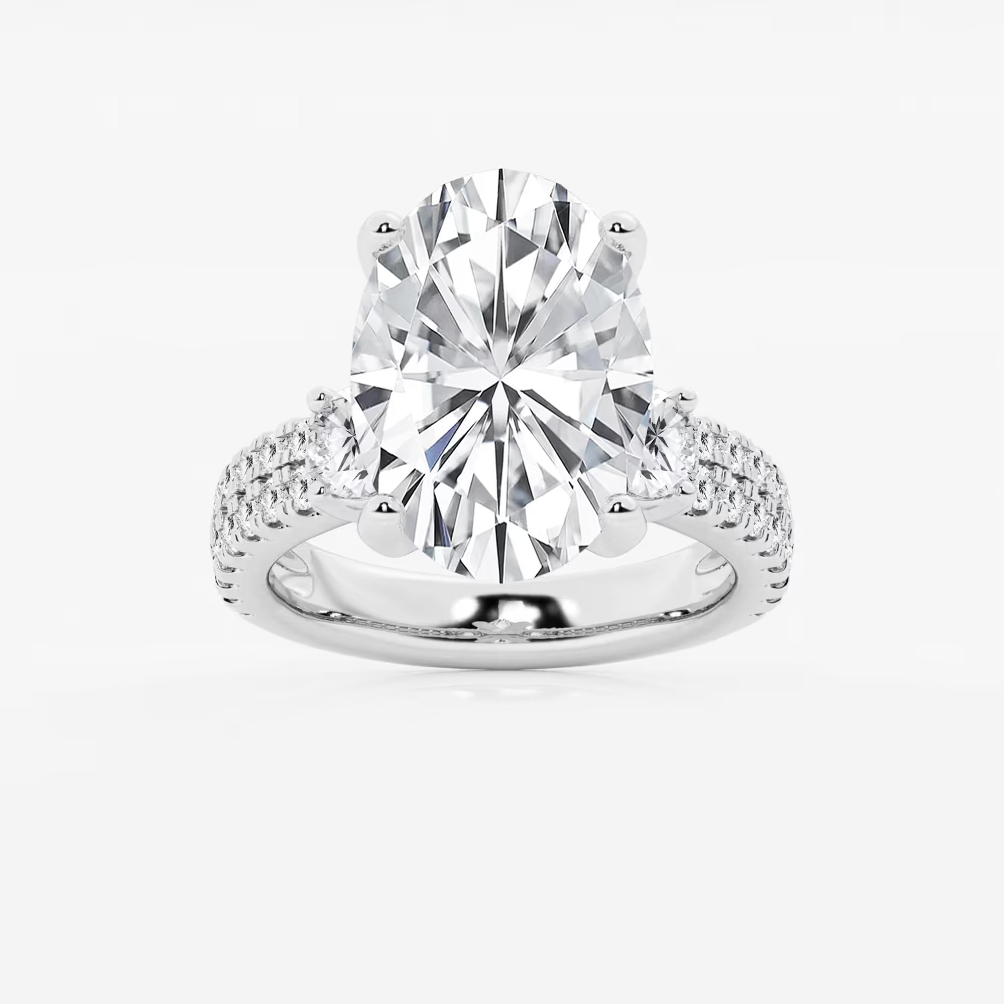 Luxurious Oval Cut Three-Stone Lab-Grown Diamond Pavé Engagement Ring