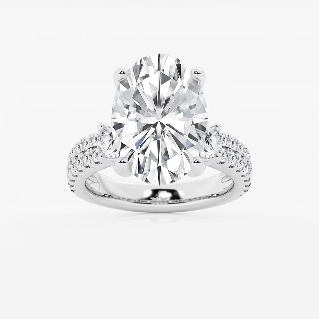 Luxurious Oval Cut Three-Stone Lab-Grown Diamond Pavé Engagement Ring
