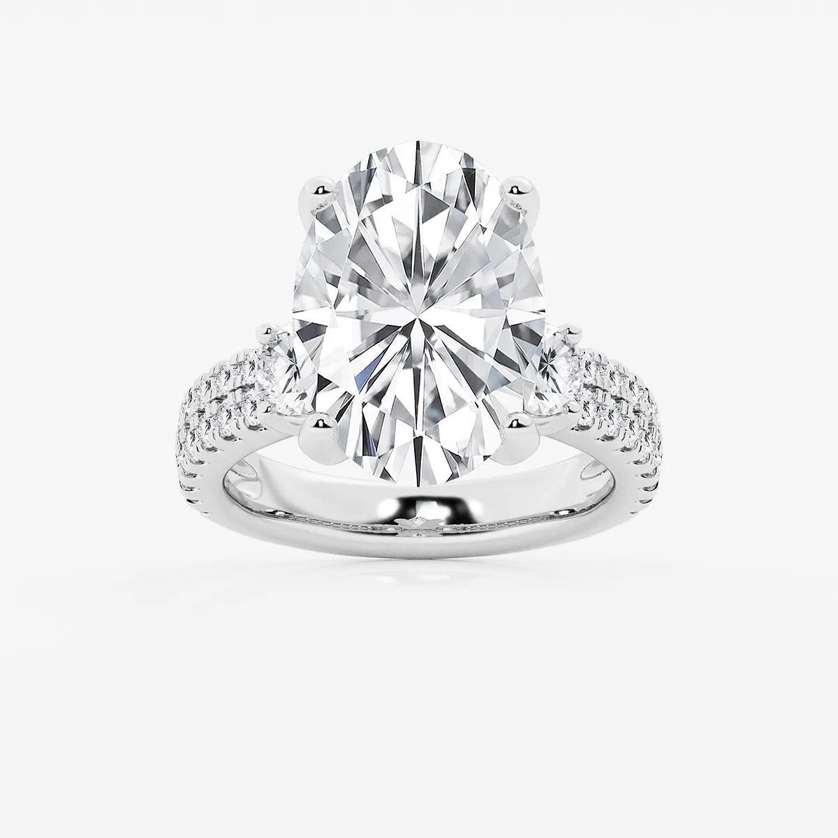 Luxurious Oval Cut Three-Stone Lab-Grown Diamond Pavé Engagement Ring