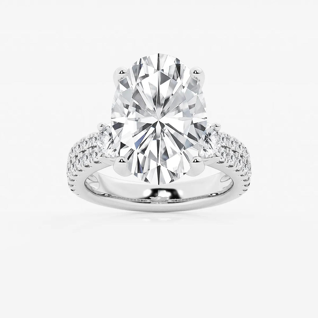 Luxurious Oval Cut Three-Stone Lab-Grown Diamond Pavé Engagement Ring