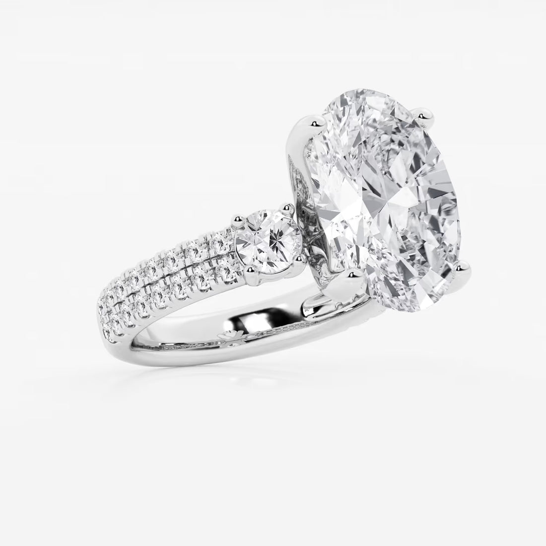 Luxurious Oval Cut Three-Stone Lab-Grown Diamond Pavé Engagement Ring