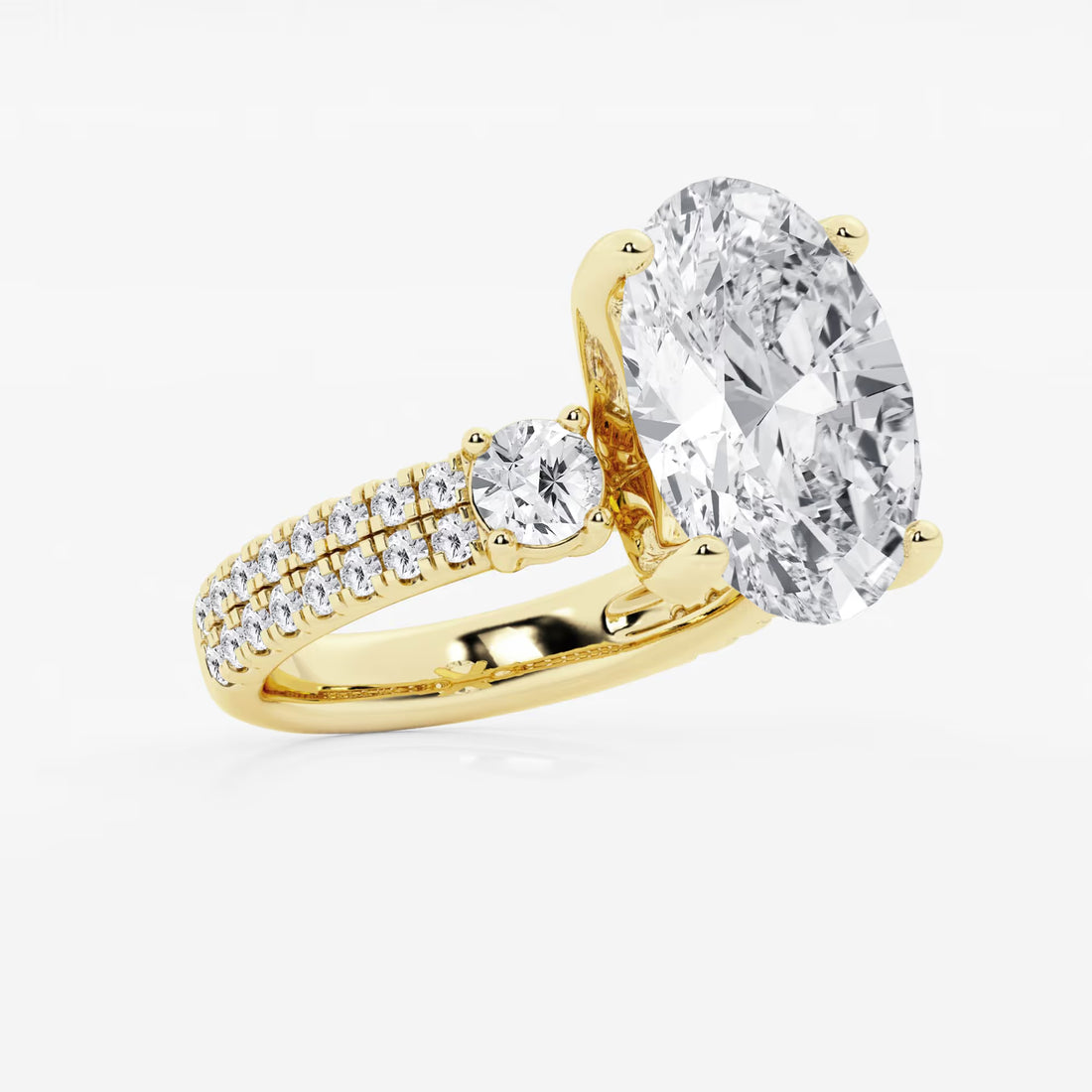 Luxurious Oval Cut Three-Stone Lab-Grown Diamond Pavé Engagement Ring