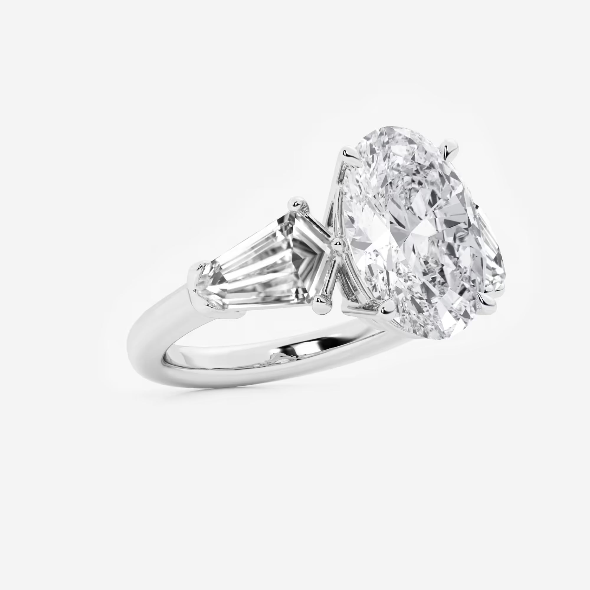 Title: Oval Cut Three-Stone Engagement Ring