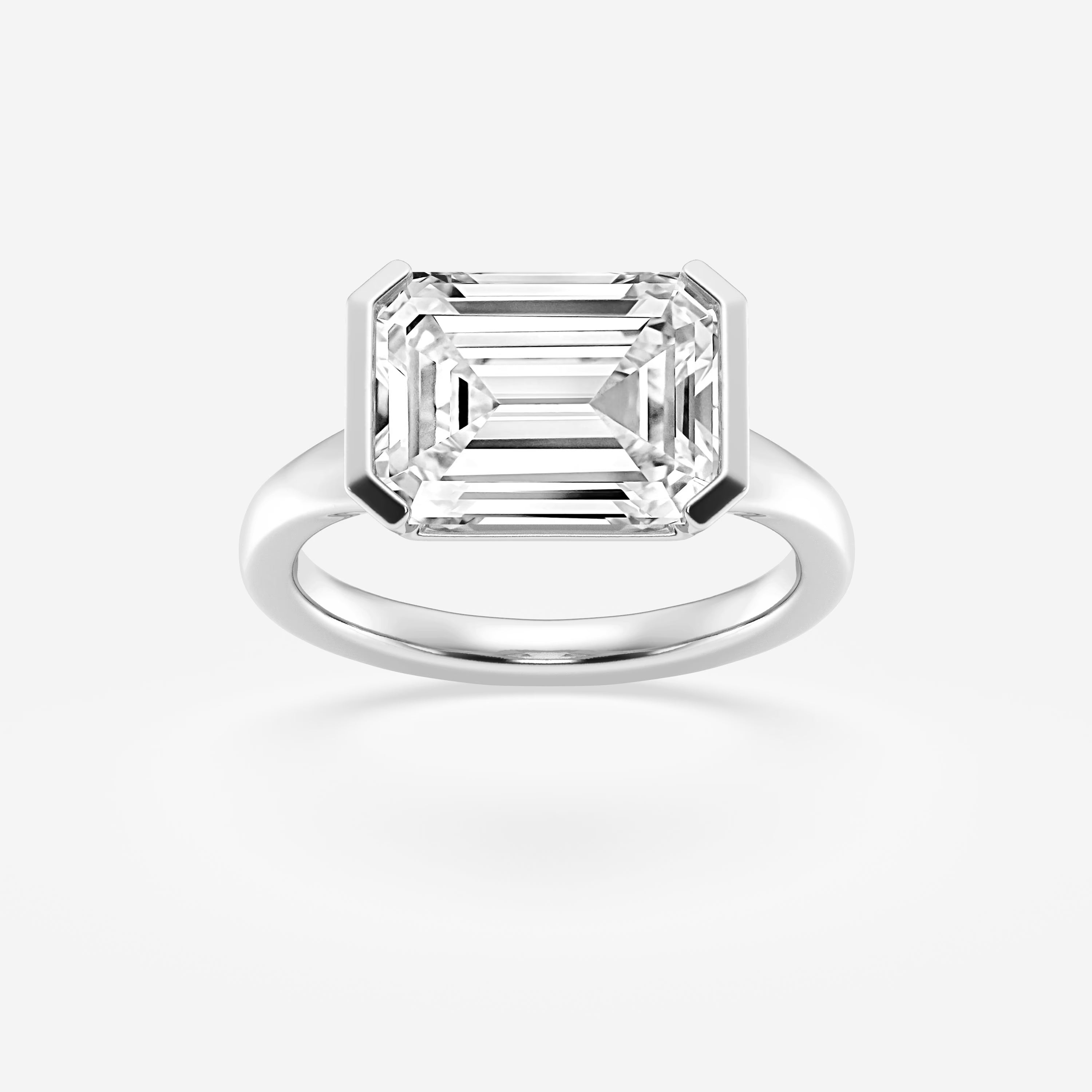 Emerald Cut East-West Bezel Solitaire Engagement Ring