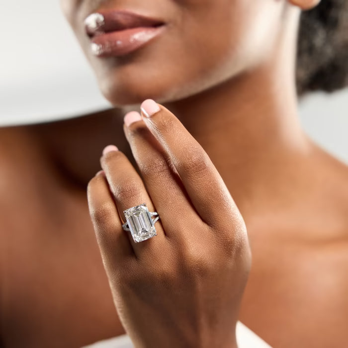 Emerald Cut Three-Stone Ring with Trapezoid Step-Cut Side Stones